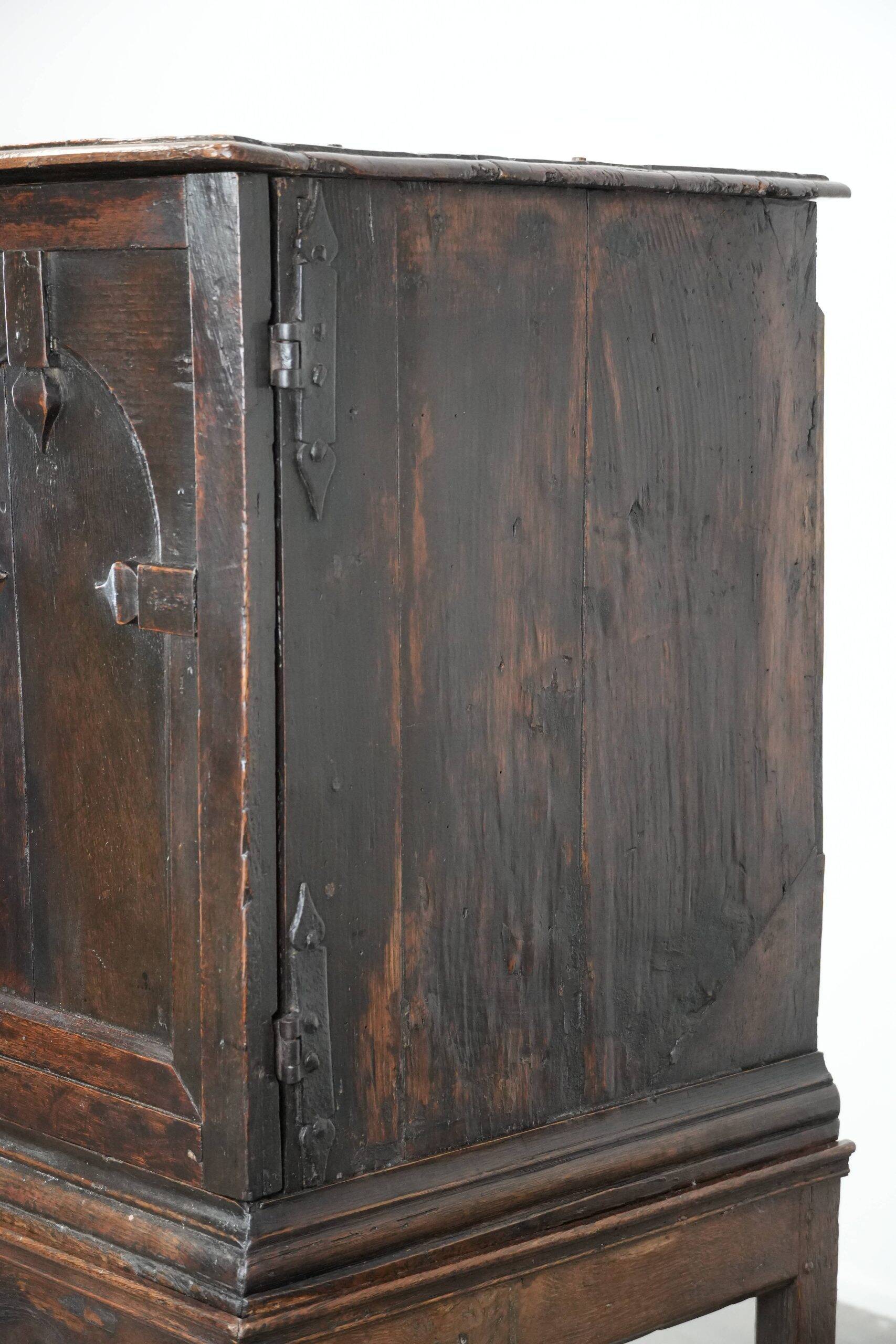 Unique antique English cabinet on stand made of oak from the 17th century