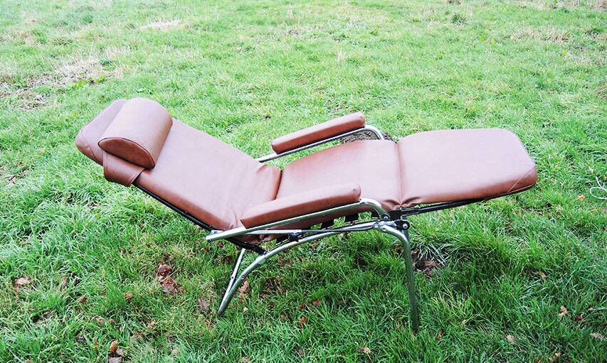 Old chaise longue in faux leather skai lama