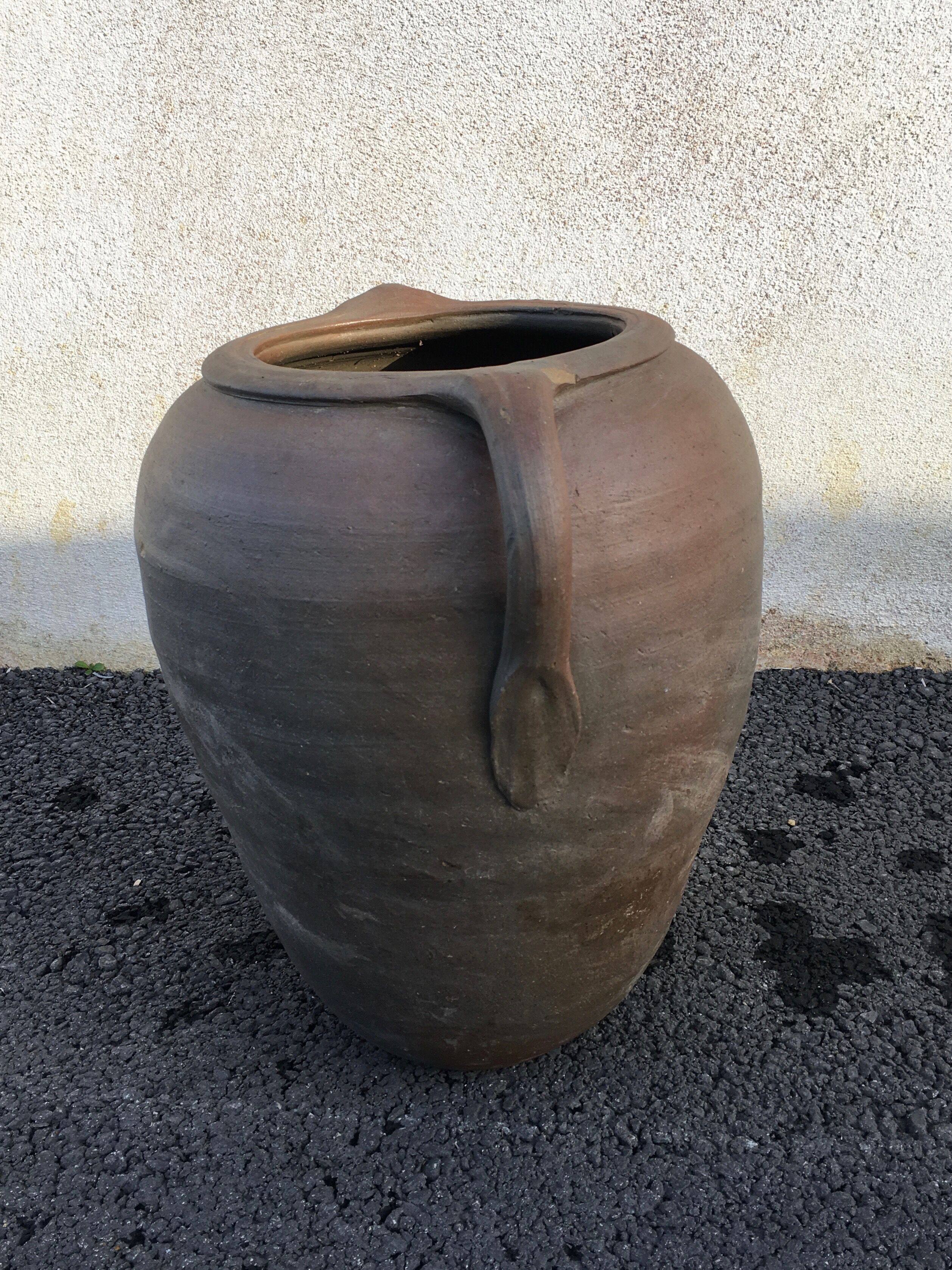Old jug with two sandstone handles