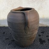 Old jug with two sandstone handles