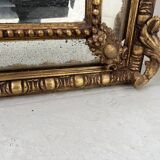 Miroir a parecloses de style Louis XVI en bois et stuc doré XIX siècle