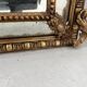 Louis XVI style mirror with parecloses in wood and gilded stucco, 19th century