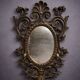 Antique Louis XV style mirror, richly carved with decorations of scrolls, shells, and foliage.