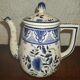 Henriot Quimper earthenware coffee set with floral decoration and elegant blue