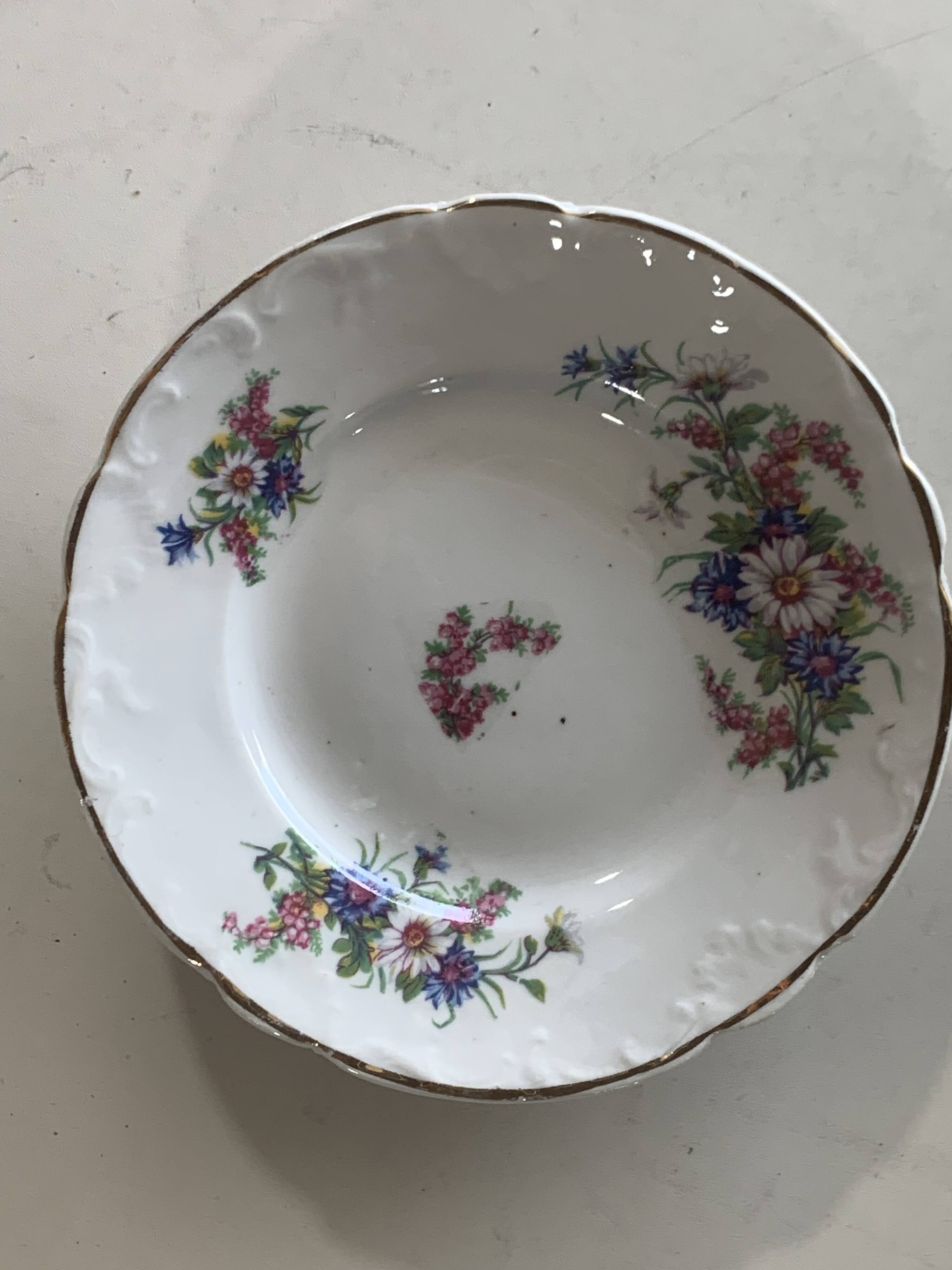 4 vintage porcelain saucers