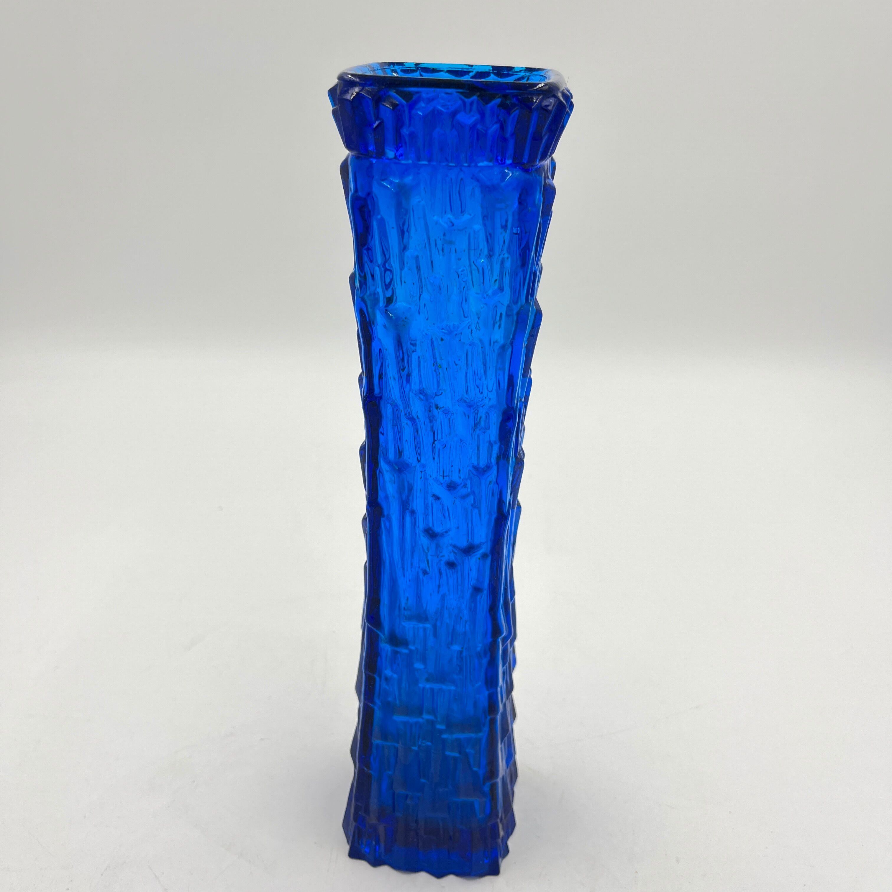 Blue glass vase with relief