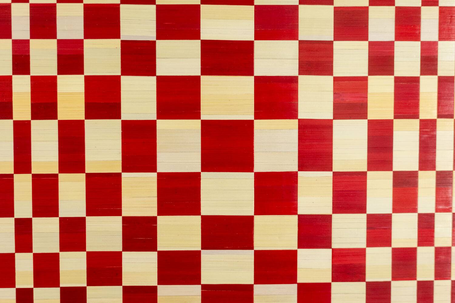 Pair of panels in red and gold straw marquetry. Contemporary.