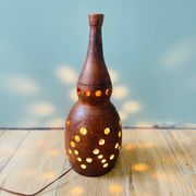 Terracotta lamp with cut-outs, circa 1970.