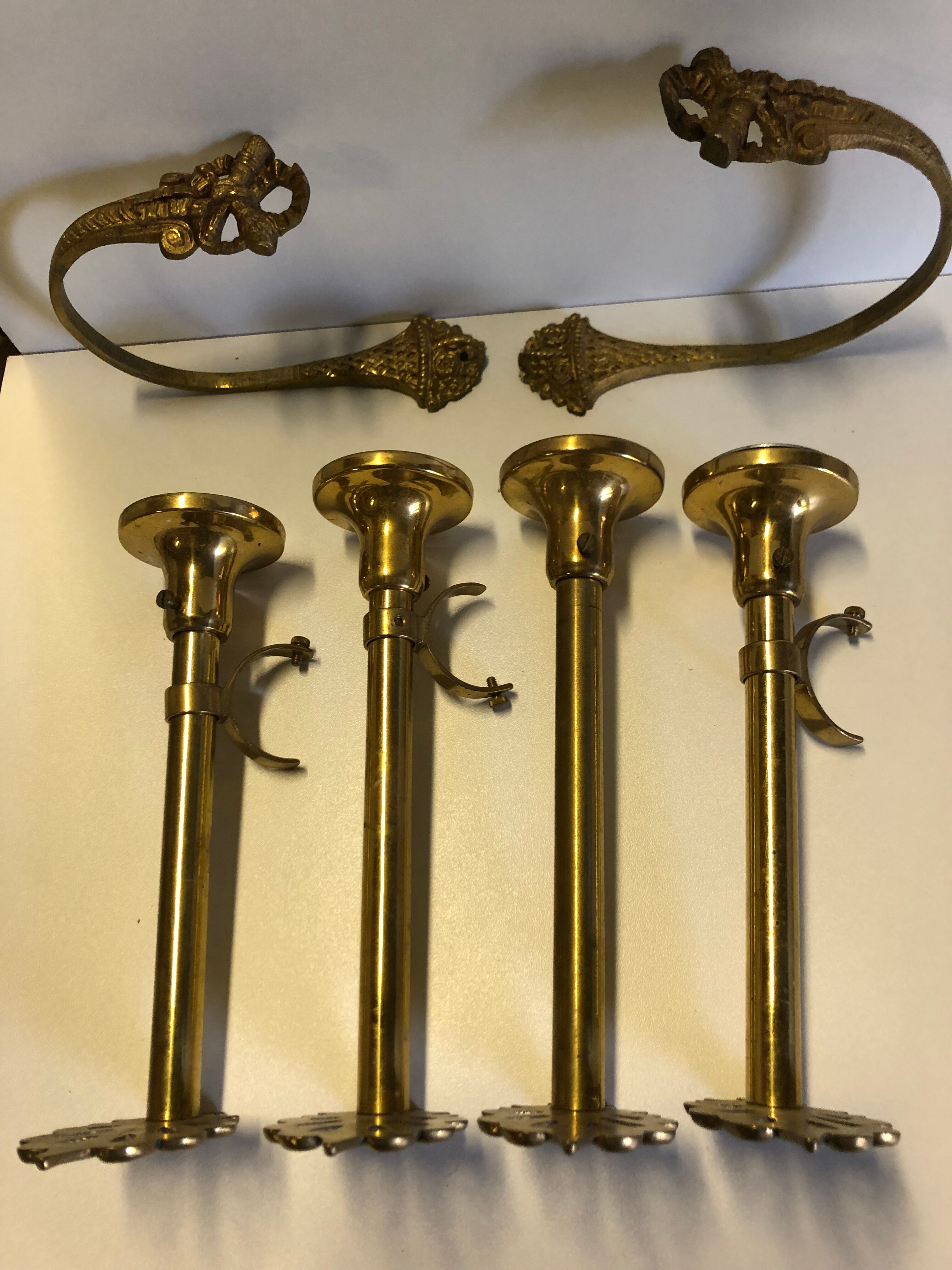 Supports curtain rods and ambers