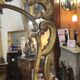 Mirror with carved and gilded wooden frame, 18th century, with scrollwork decoration.