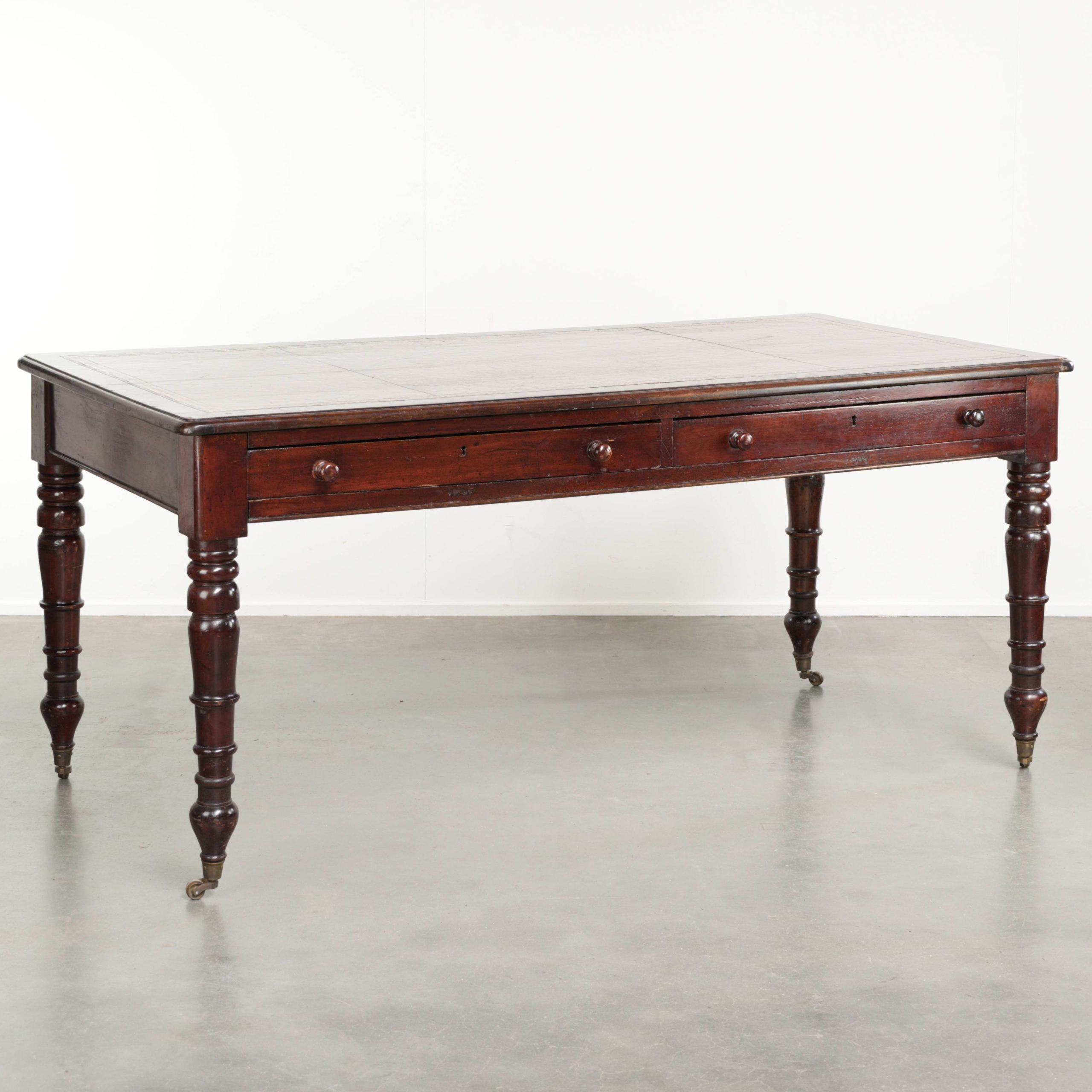 Antique English writing desk from the late 19th century with a warm colour