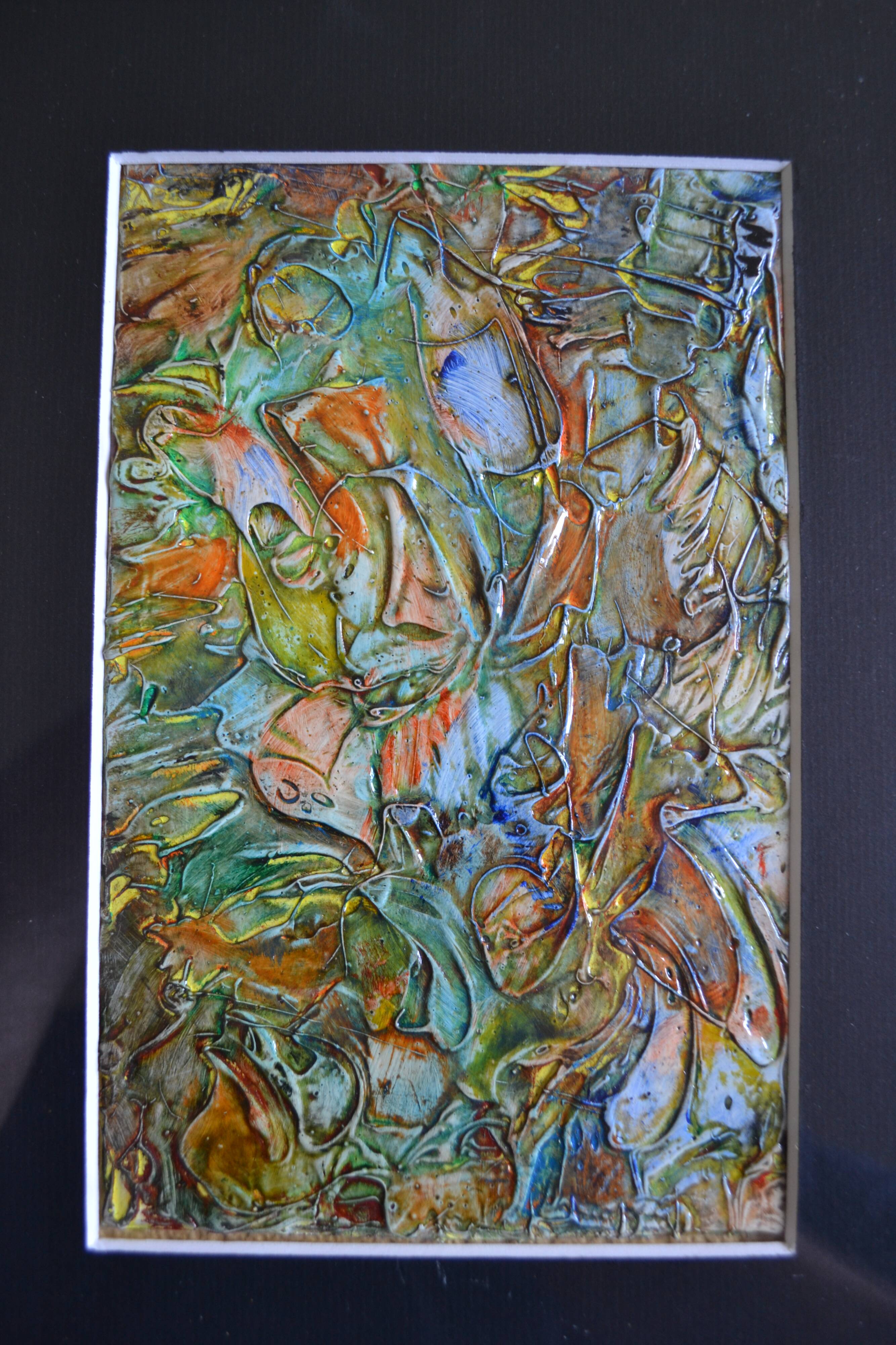 Framed abstract painting under glass