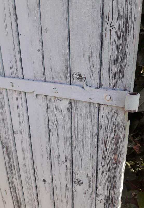 Pair of large wooden iron hanging shutters