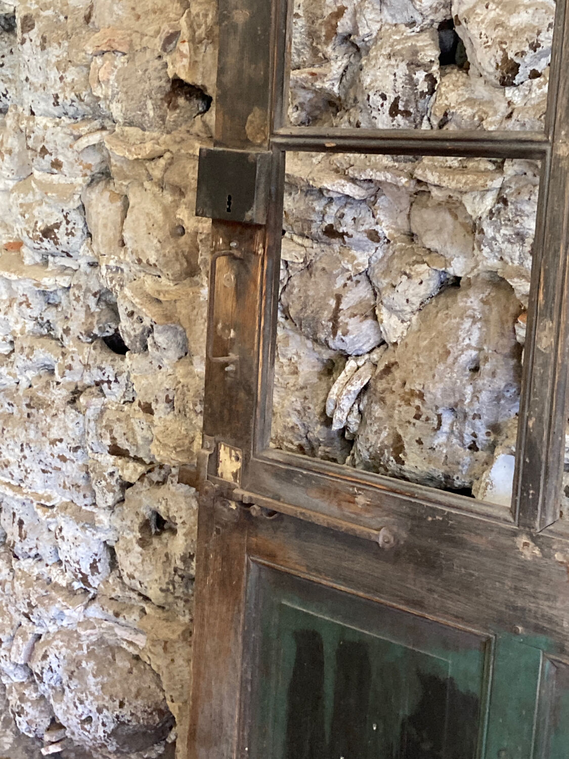 Old glazed wooden door patinated