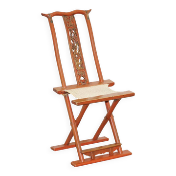 Antique Chinese folding chair with carvings, circa 1900-1920.