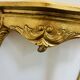 Golden console in Louis XV Rococo style made of resin.