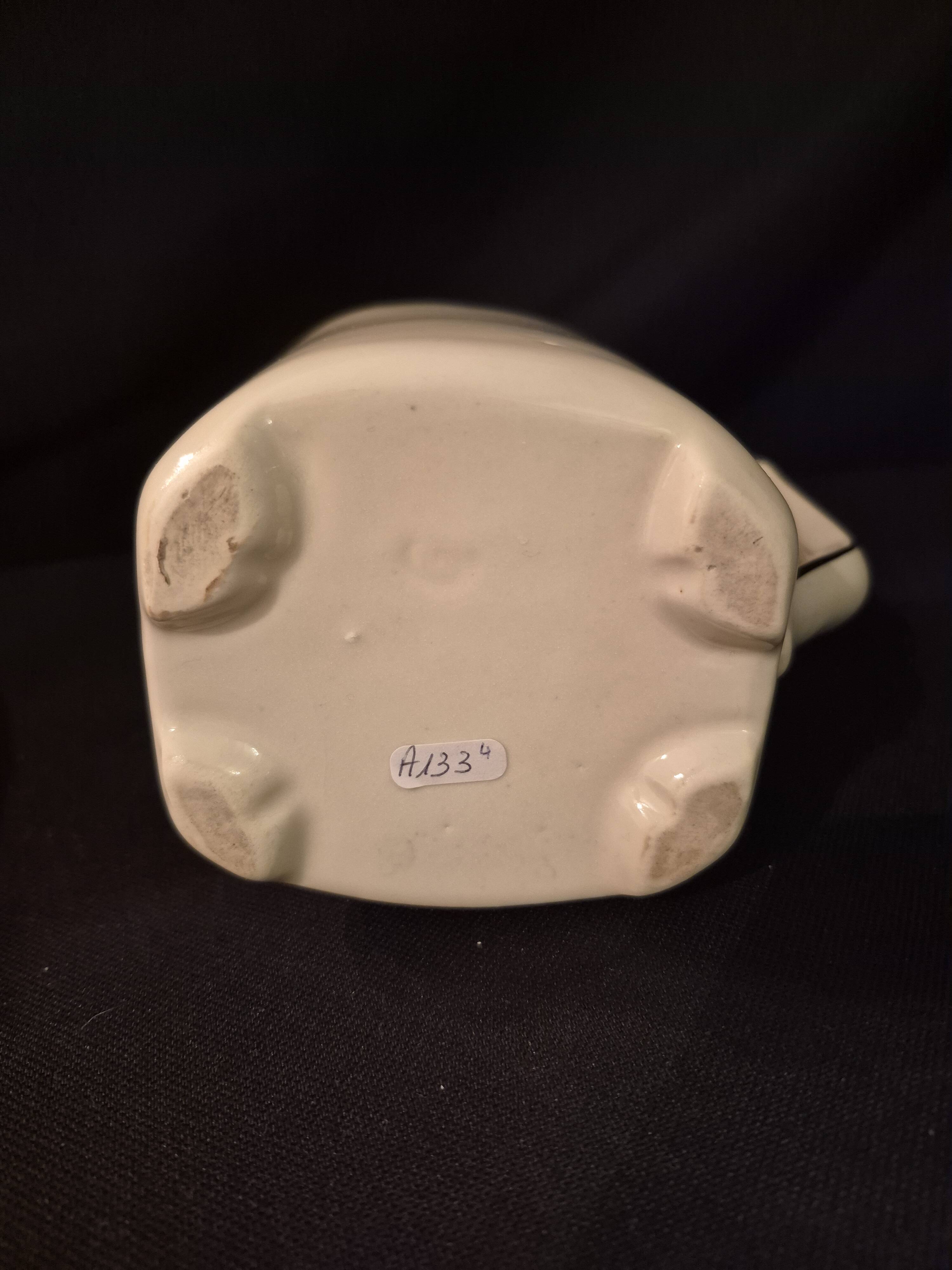 Old covered jug, vintage, geometric frieze with flowers and black trim.