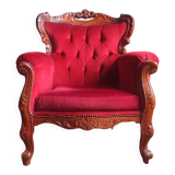Baroque style carved wooden armchair in burgundy red velvet