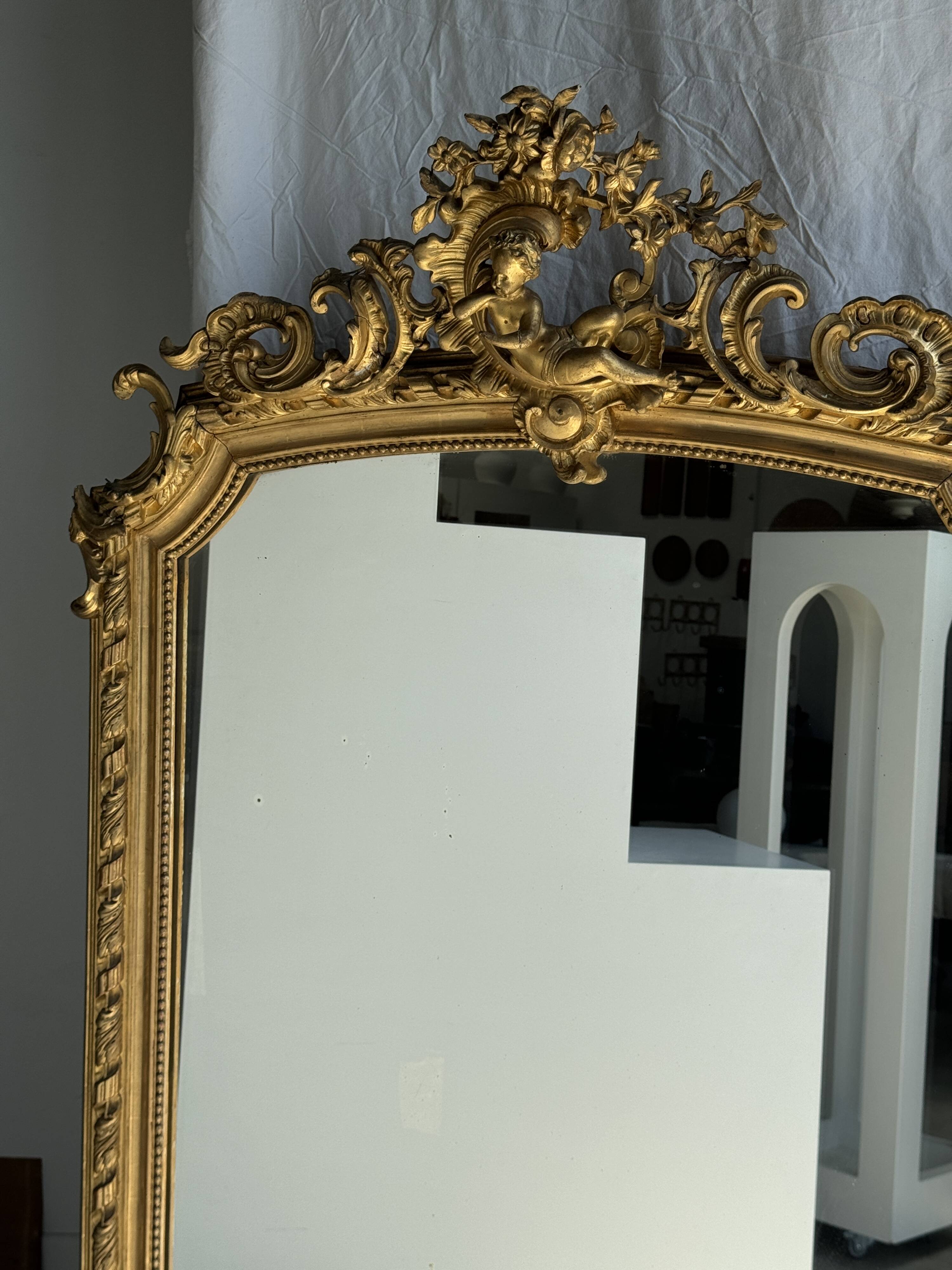 Large gilded mirror with acanthus leaf pediment H150 L98