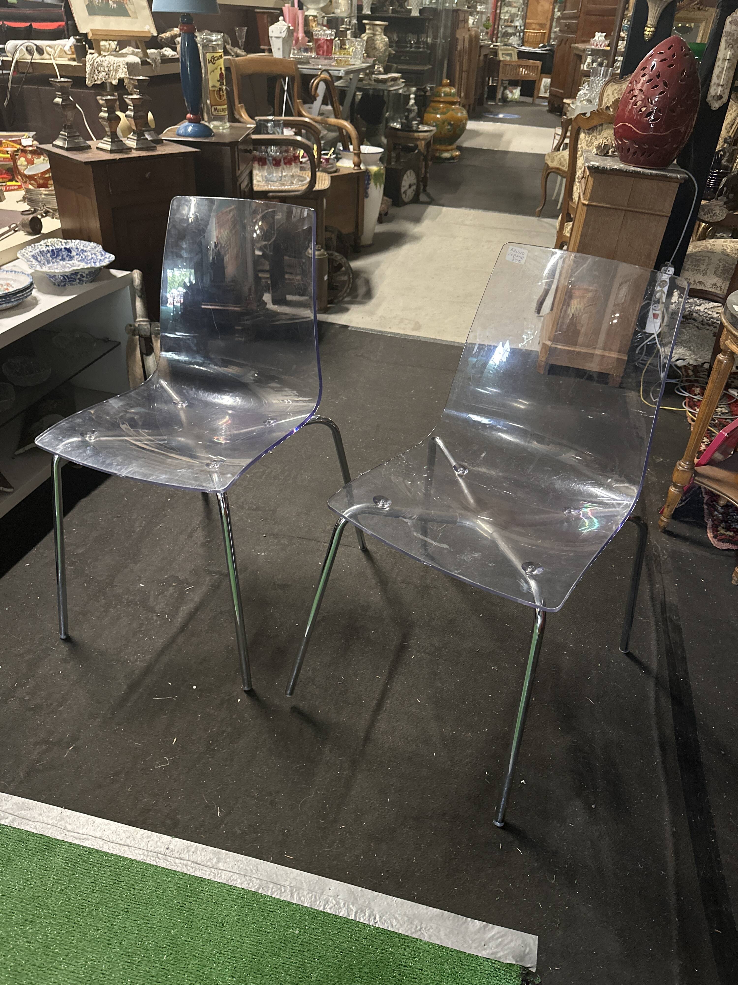 Pair of smoked polycarbonate chairs