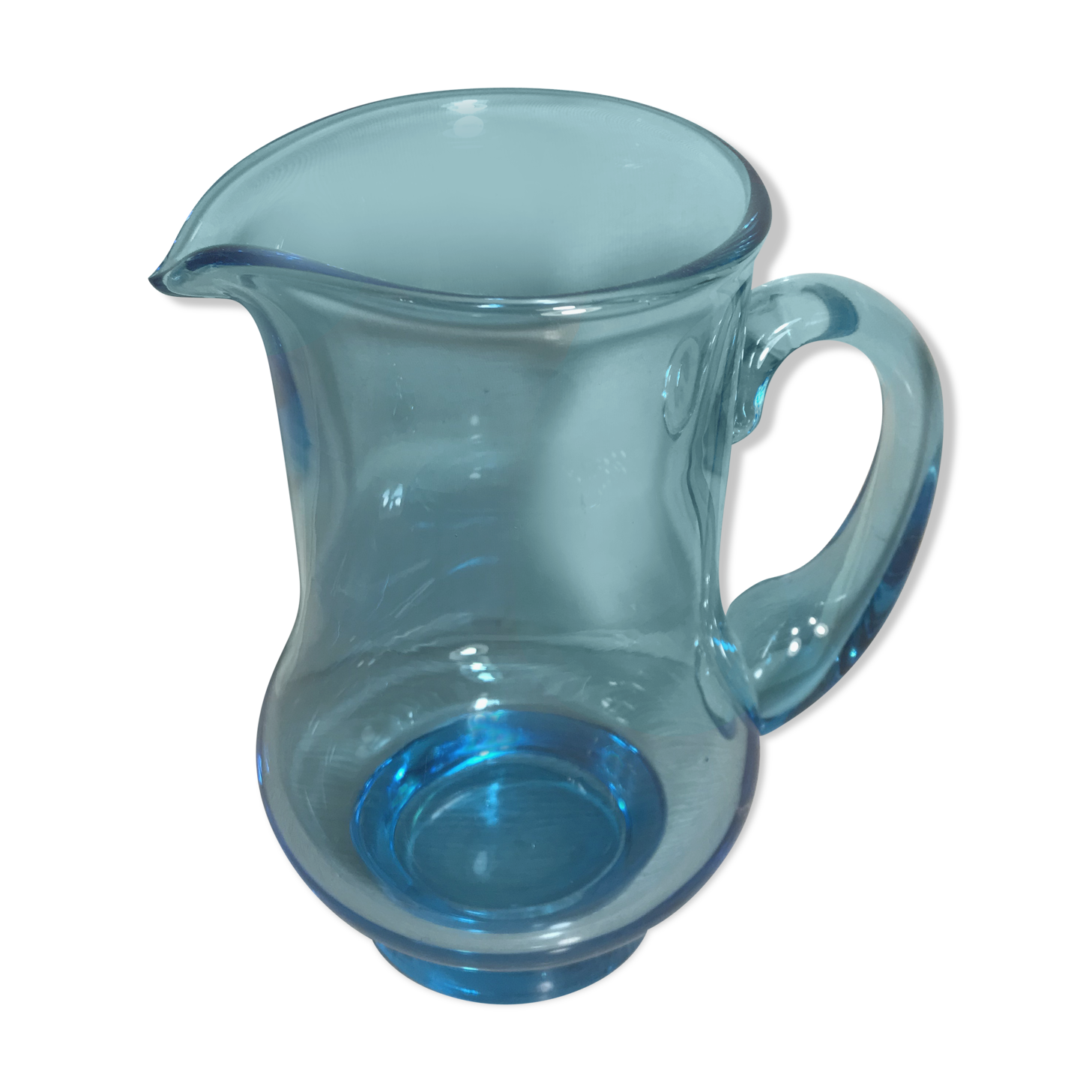 Old blue blown glass pitcher with vintage handle