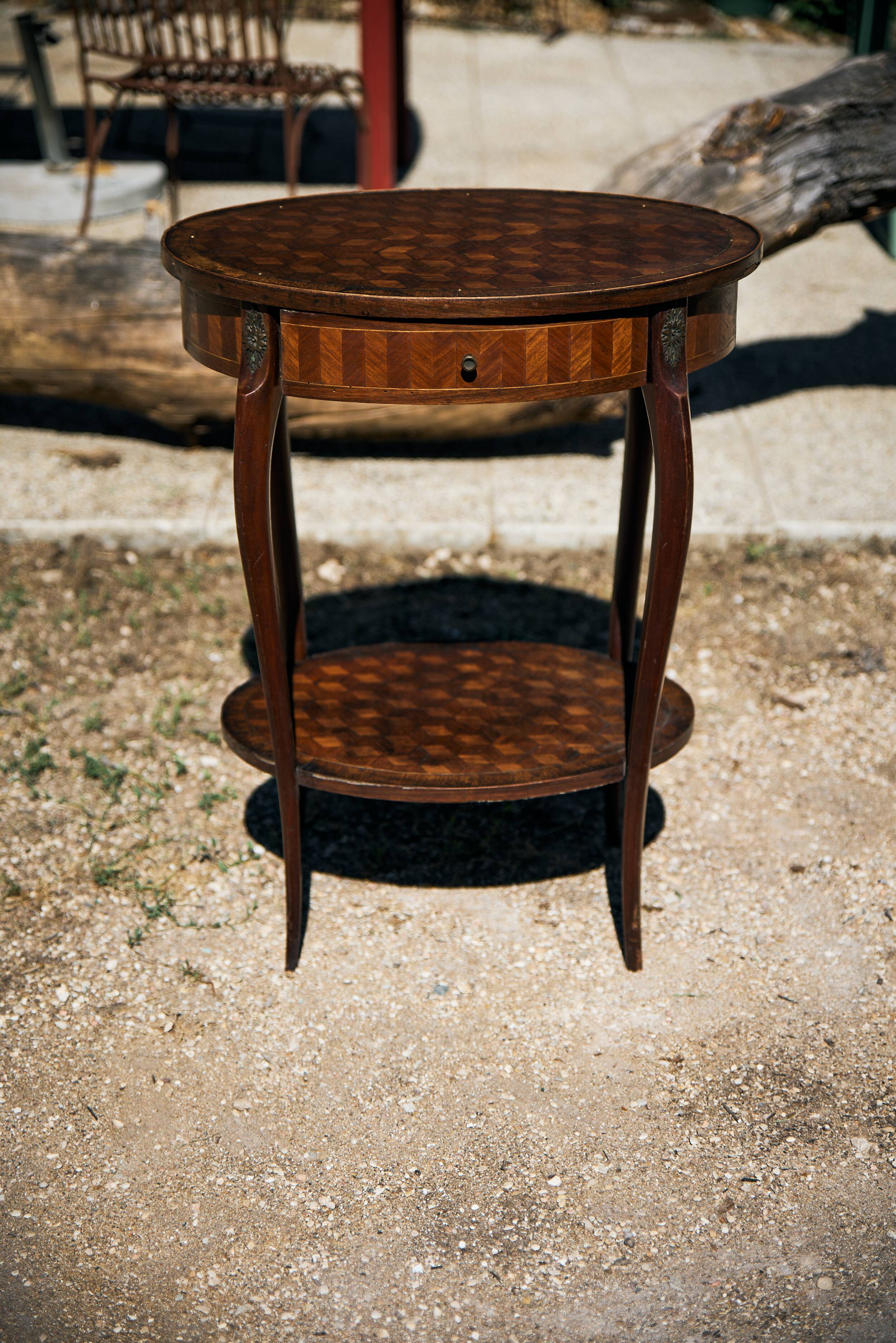 Oval coffee table in cube marquetry and bronze, Louis XV style.
