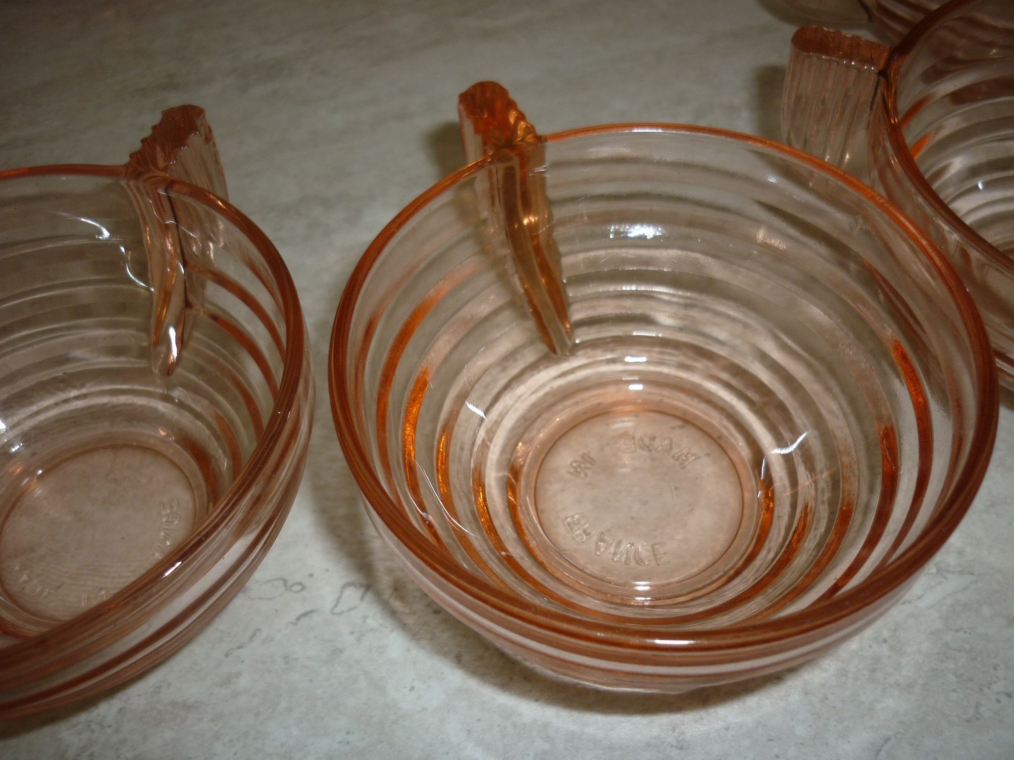 Lot 9 art deco cups in pink transparent glass
