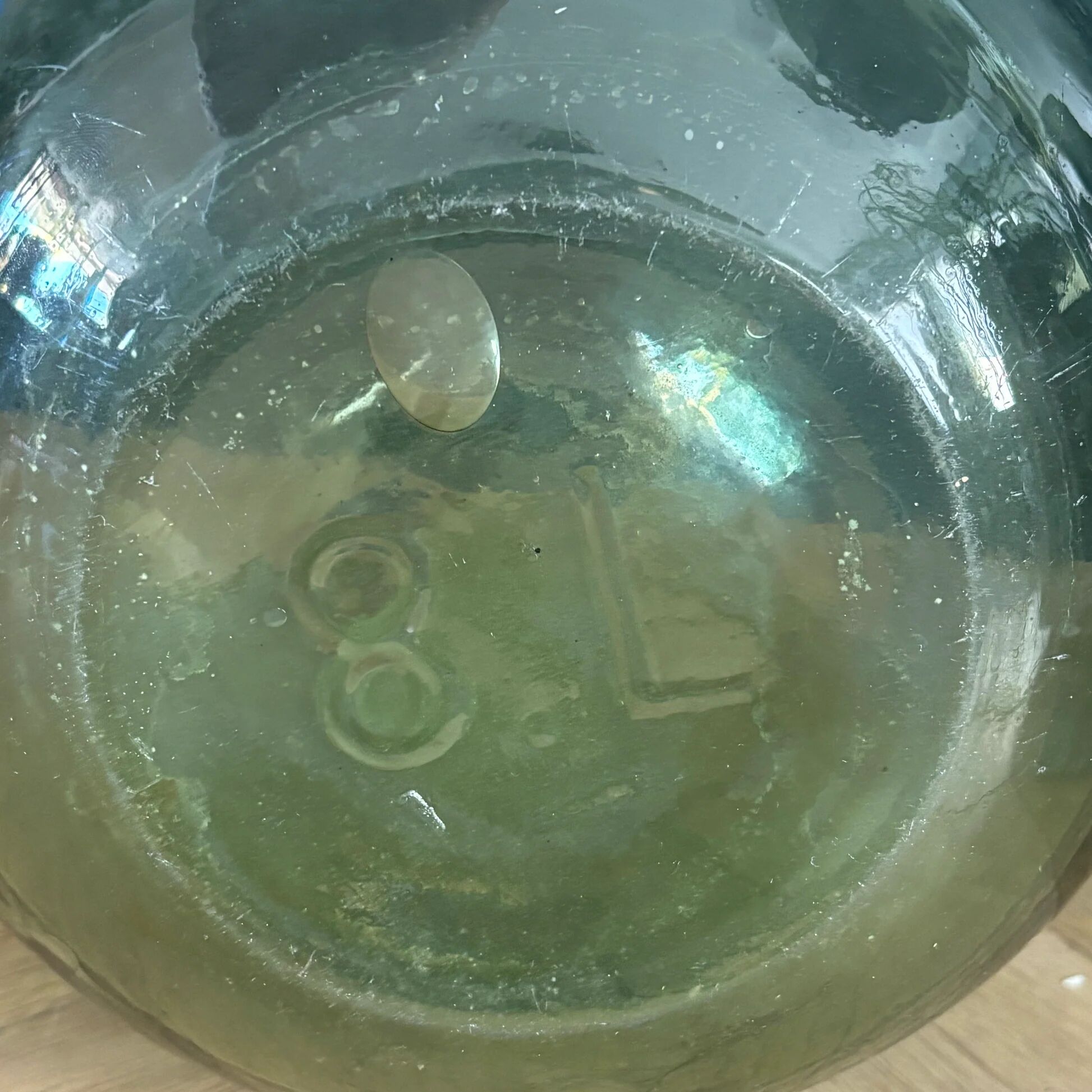 Antique green glass carafe