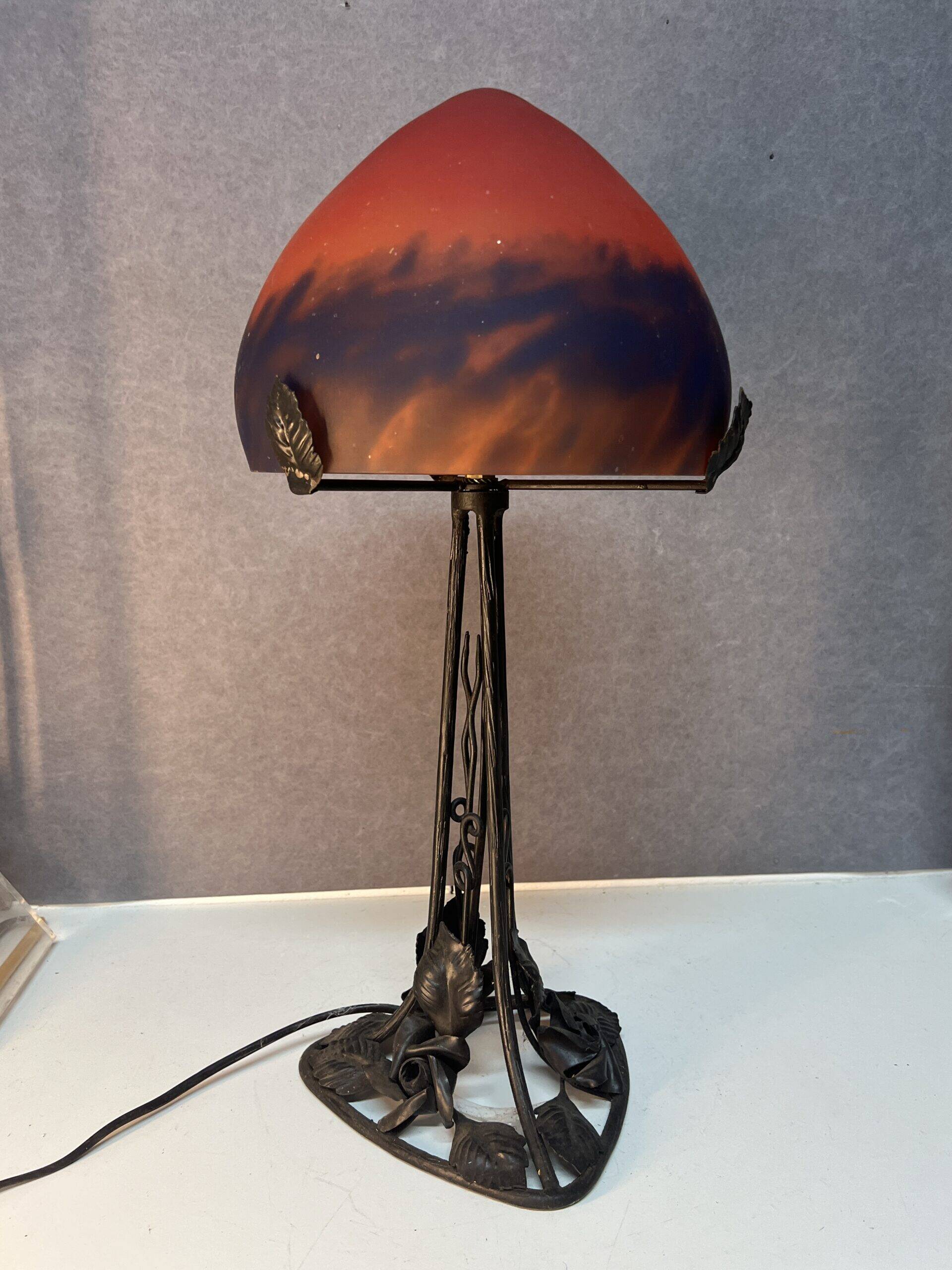 Contemporary mushroom lamp, wrought iron base and orange glass shell with blue hues in the art deco style