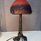Contemporary mushroom lamp, wrought iron base and orange glass shell with blue hues in the art deco style