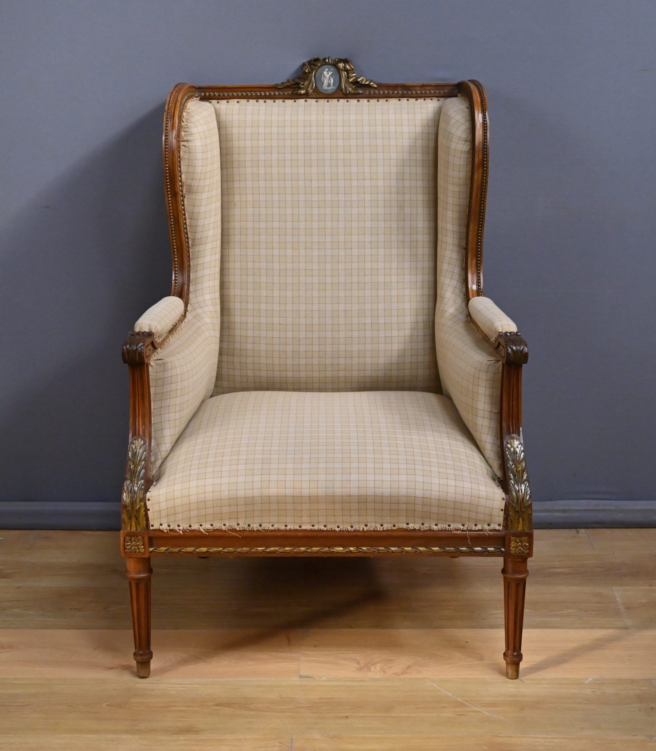 Wingback armchair in walnut, Louis XVI style – late 19th century