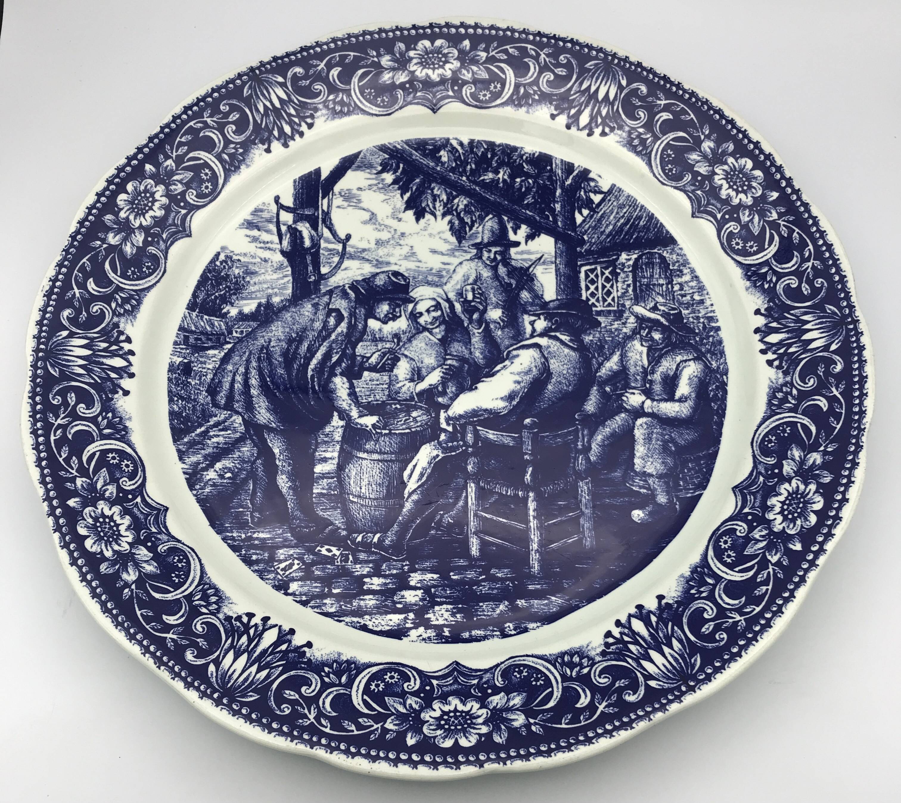 Blue enamelled earthenware wall dish with peasant scene decor Boch La Louvière