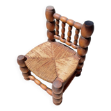 Low chair 50s oak and straw by the fire