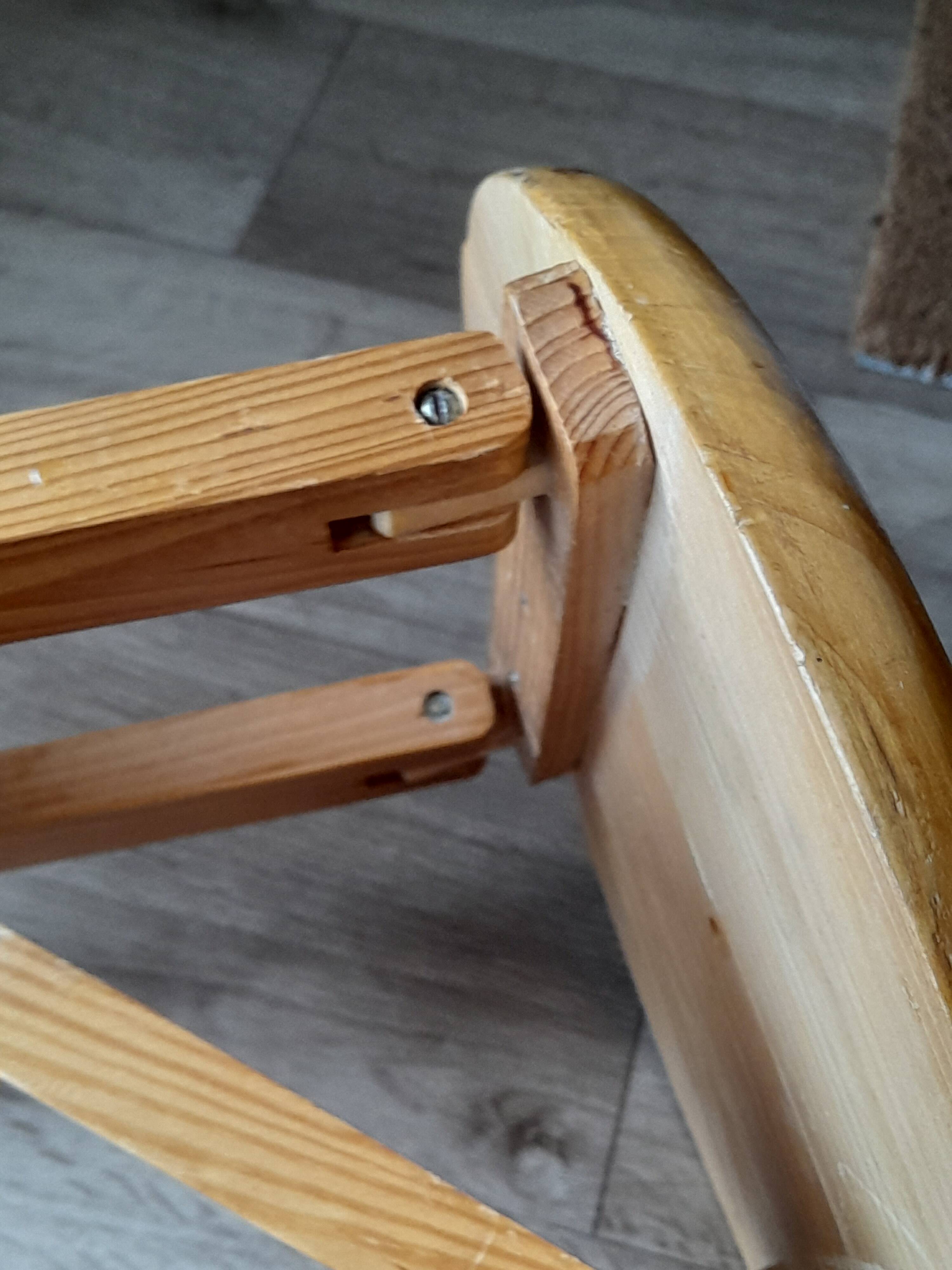 Folding wooden stool by Roger Tallon from the 1970s.