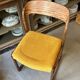 Chaise Baumann modèle "Traîneau" en bois foncé et coton ocre