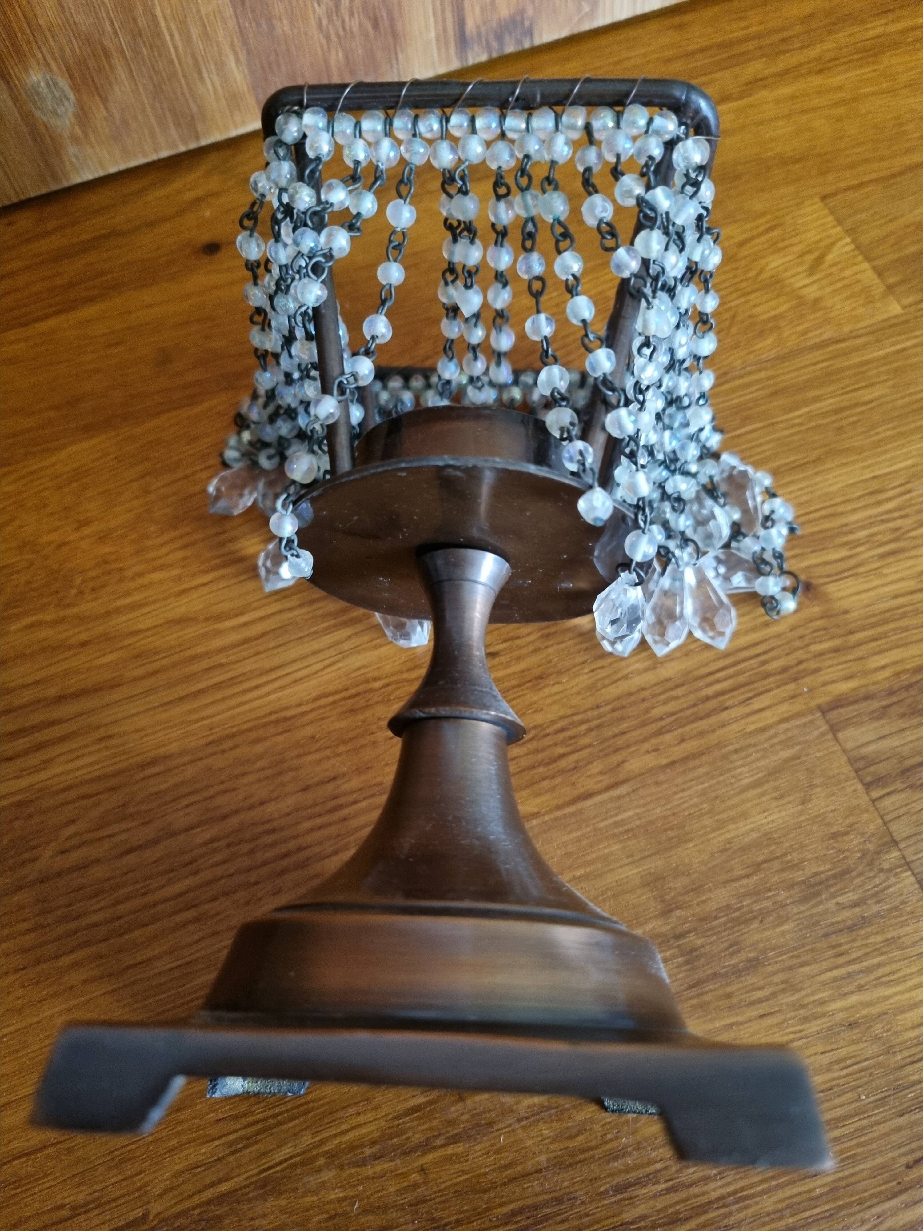 Metal candle holder with white glass tassels