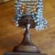 Metal candle holder with white glass tassels