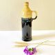 Enameled ceramic bottle with handle