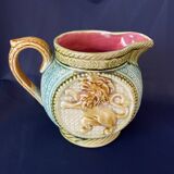 Small onnaing barbotine jug with lion decoration