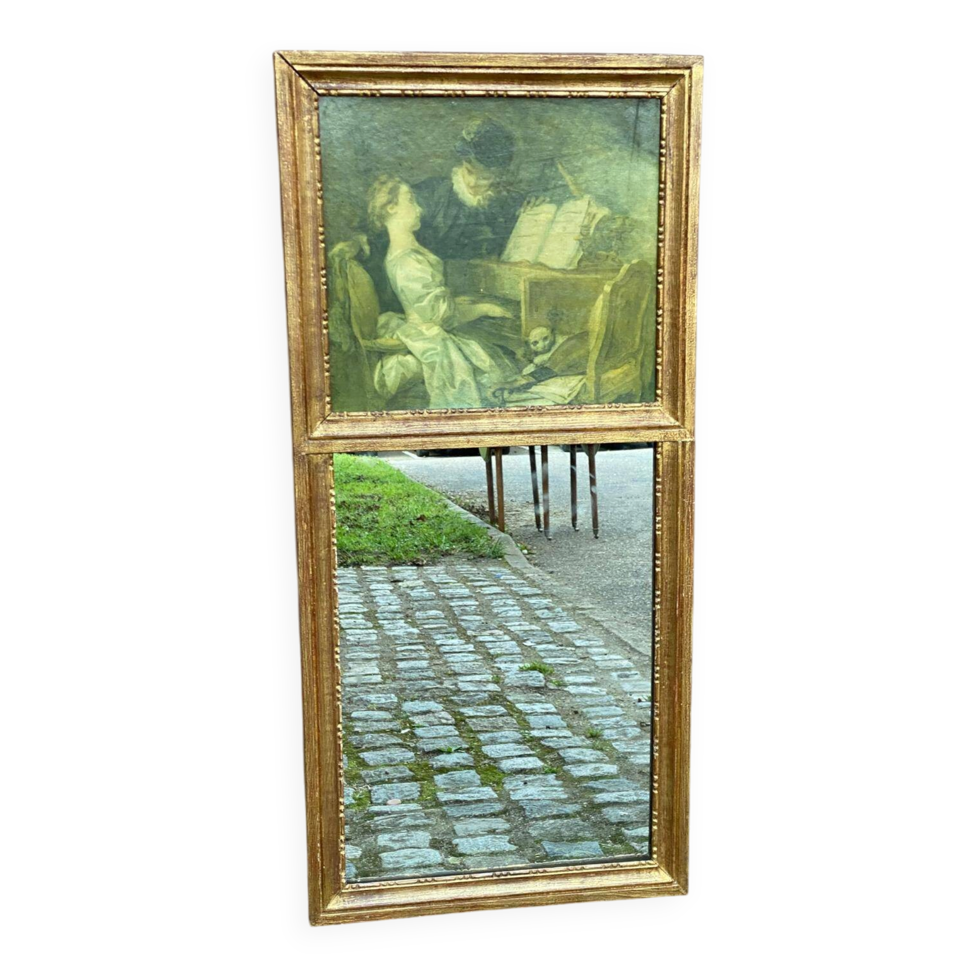 19th-century trumeau with mirror and music lesson canvas.