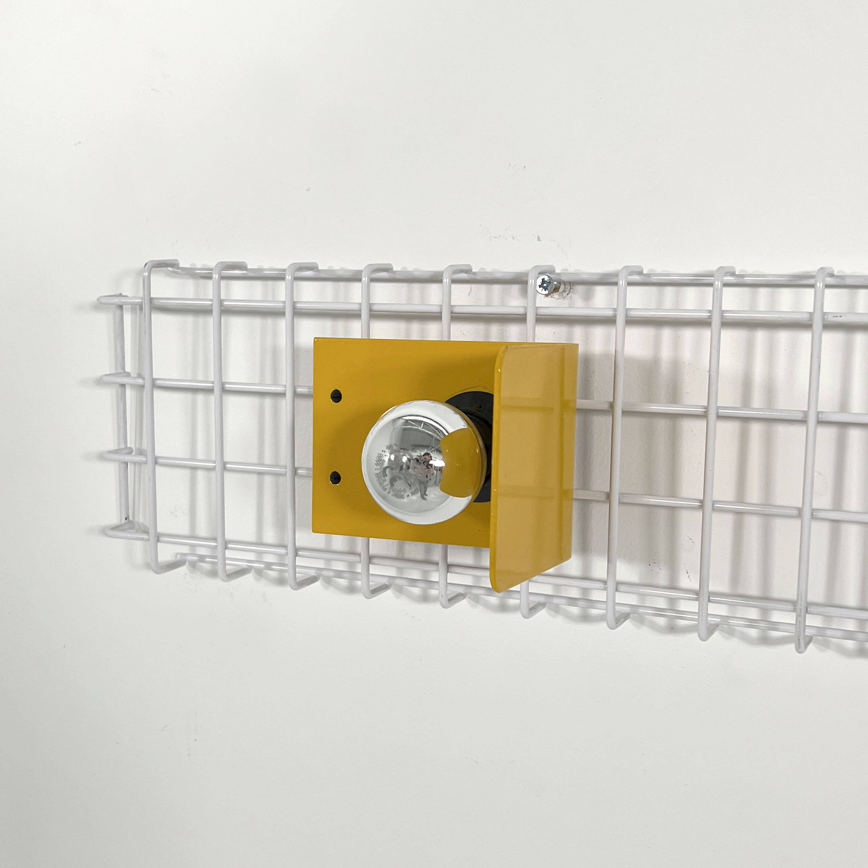 Pair of yellow wall sconces on wire mesh by Seccose, 1980