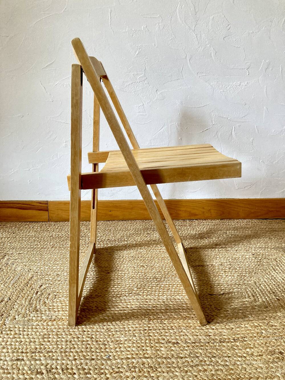 Folding chairs designed by Aldo Jacober in solid beech wood.
