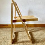 Folding chairs designed by Aldo Jacober in solid beech wood.