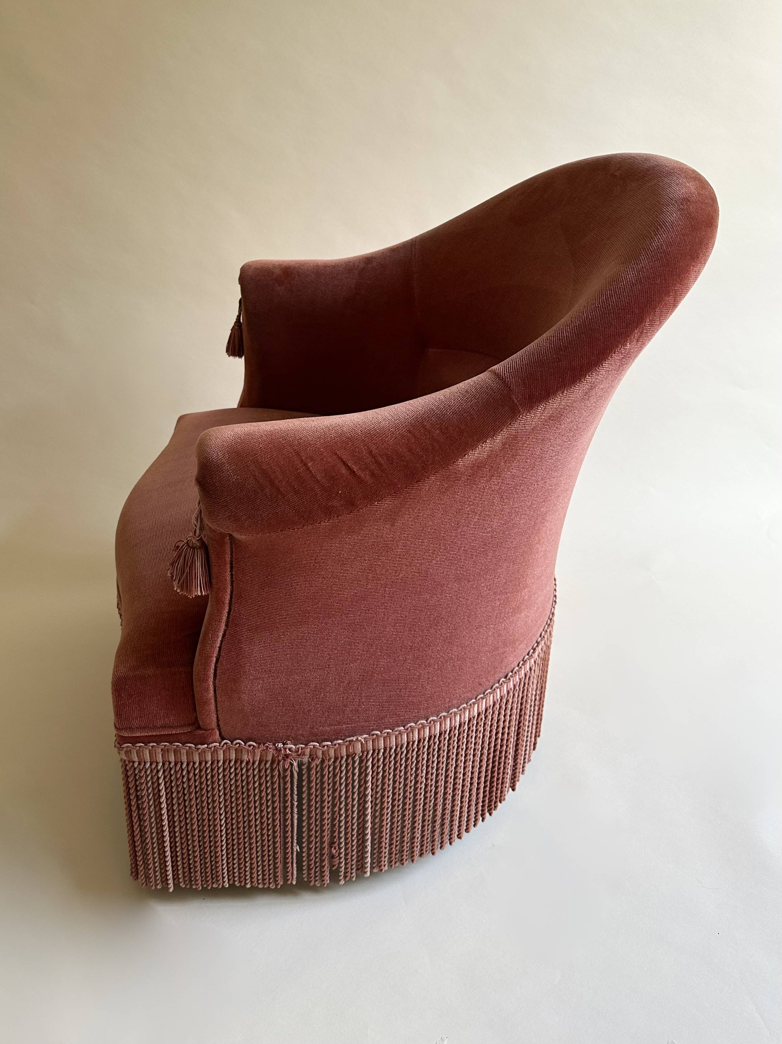 Pink-orange velvet tub chair