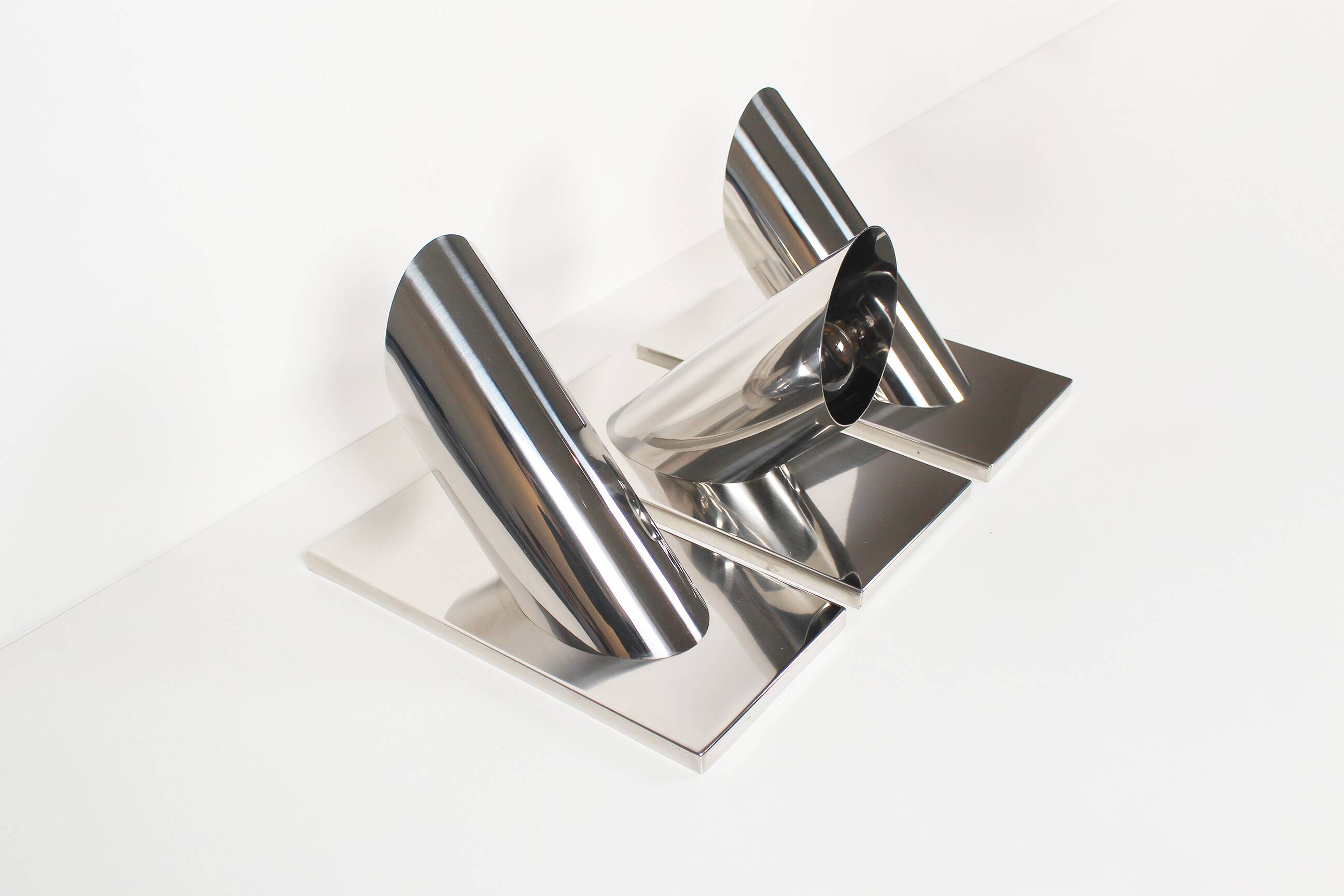 Set of three large sculptural vintage chrome metal wall lights