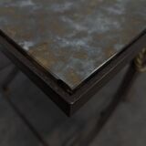 Neoclassical side table in wrought iron and eglomisé glass.