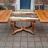 Napoleon III period walnut table from the late 19th century with extensions for 16 covers.