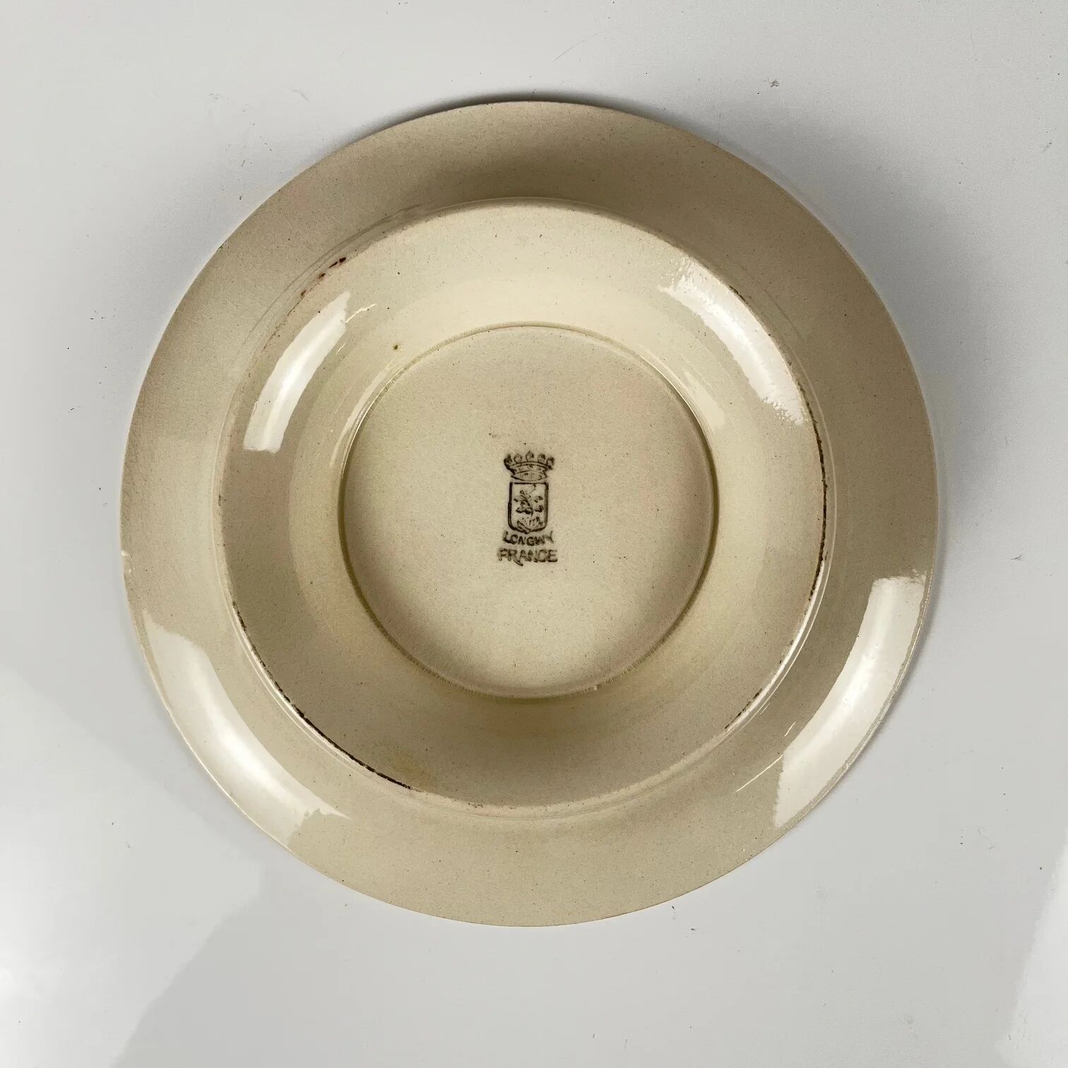 Presentation plate with pedestal Longwy, early 20th century, floral decoration.