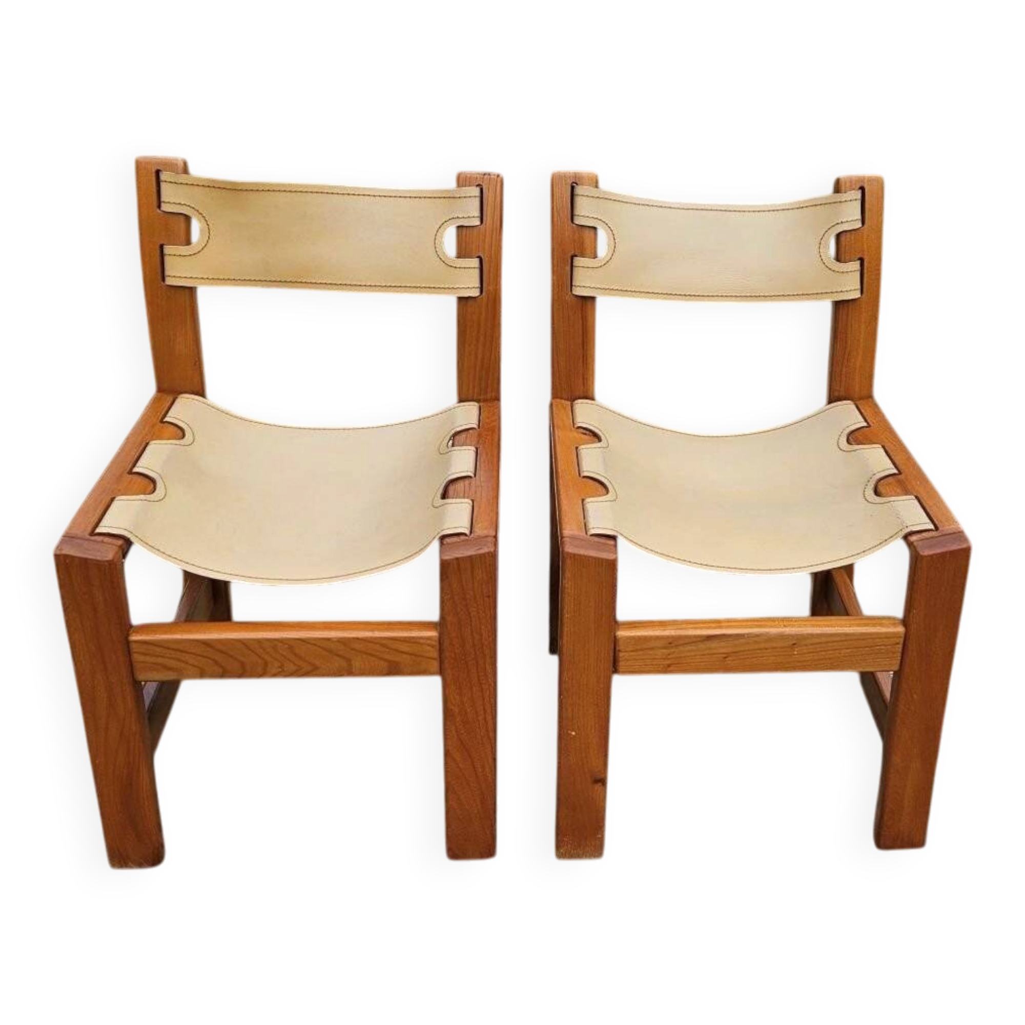 Pair of elm and leather chairs by Maison Regain