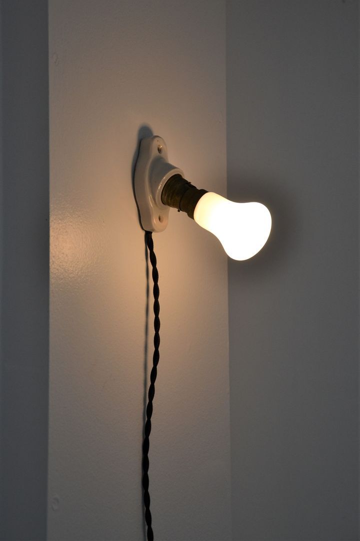 Oval porcelain hook to plug into socket